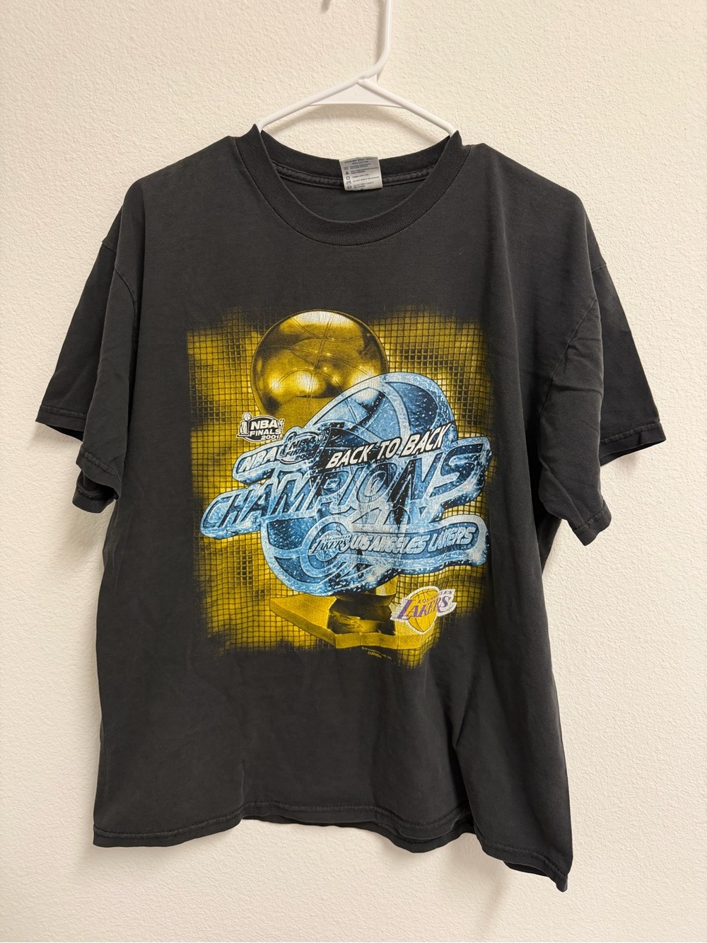 Delta Black Short Sleeve Tee with Blue and Yellow Lakers Graphic